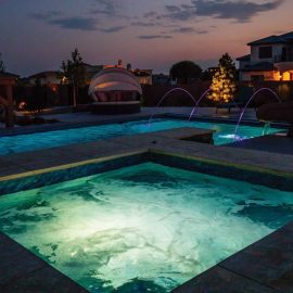 pool and hot tub at night
