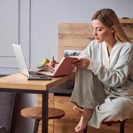 woman writing in a journal